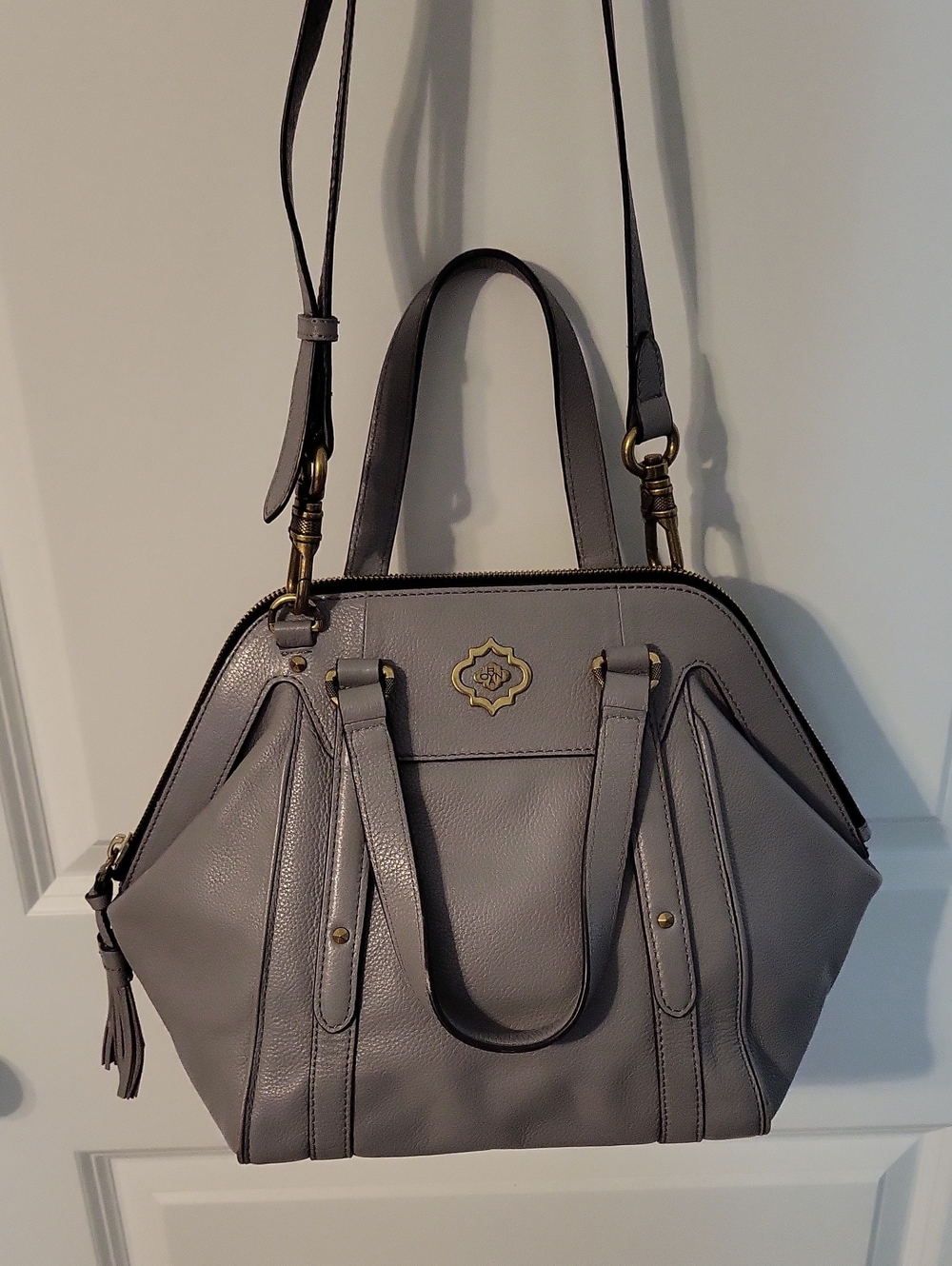 orYANY Gray Leather Satchel with Tassel and Gold Accent.